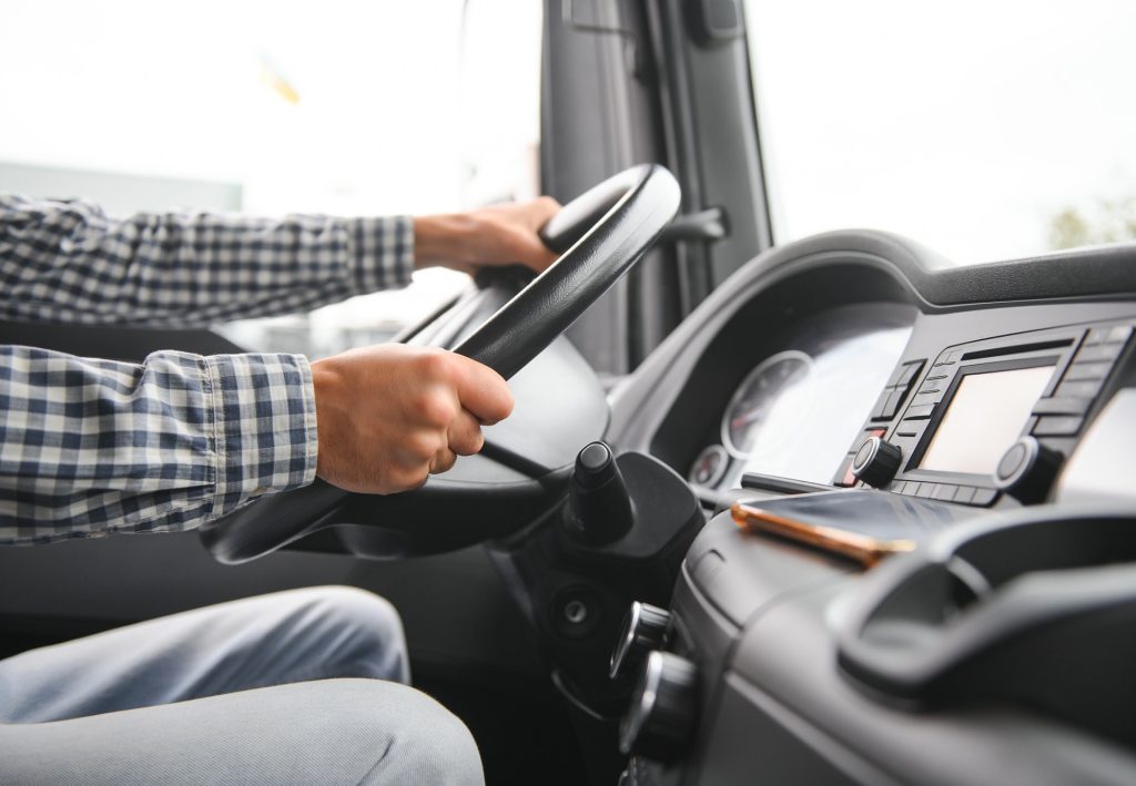 Truck drivers big truck of driver's hands on big truck steering wheel